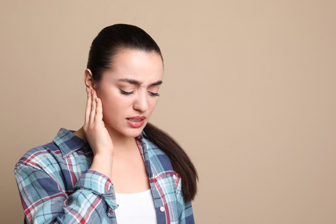 Young Woman Suffering from ear pain